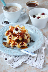 Waffles with whipped cream and berry jam