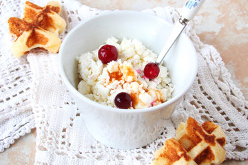 Cottage cheese for Breakfast with berry jam and cranberries