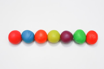 colorful playdough close up image on white background.