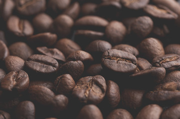 Coffee beans on stone background. Top view with copy space for your text