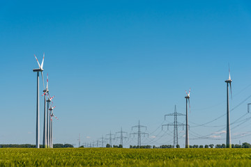 Wind power plants and power transmission lines seen in rural Germany 