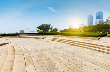 Panoramic skyline and buildings with empty concrete square floor