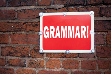 Obraz premium Hand writing text caption inspiration showing Grammar concept meaning The Basic Rules of Syntax Grammatical Language written on old announcement road sign with background and copy space