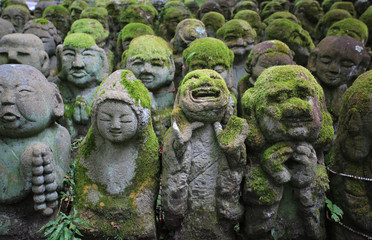 Fototapeta na wymiar buddha stone carving statue in japan kyoto