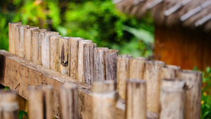Fototapeta premium the fence of old dry bamboo wood