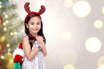 Little girl with christmas background