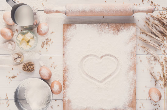 Love baking background, flour with drawn heart