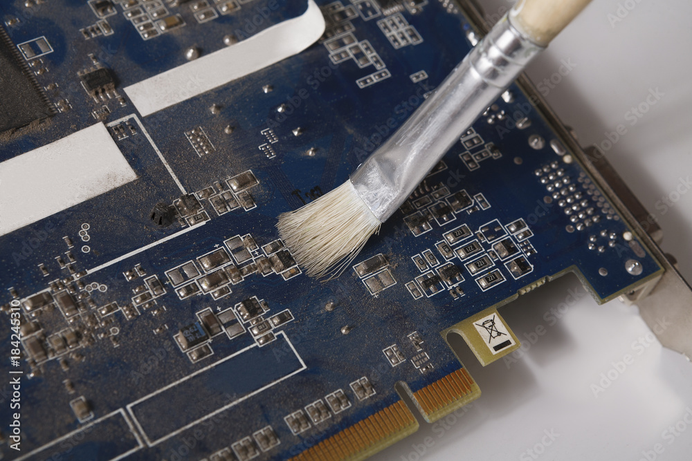 Poster Cleaning computer components close up