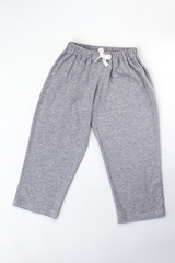 Plain gray pajama pants with white drawstring. Cozy melange cotton. Sleepwear bottom for boys.