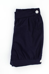 Dark blue folded in half on white background. White button fasteners. Simple design and quality fabric for kids.
