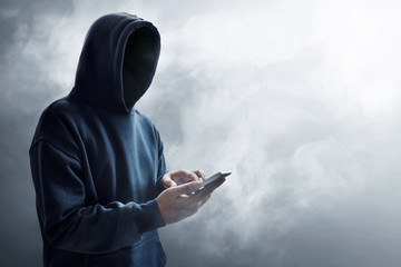 Hacker using mobile phone