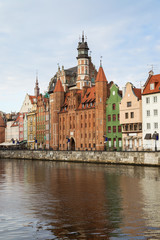 View of St. Mary's Gate (Brama Mariacka) and other old buildings along the Long Bridge waterfront at the Main Town in Gdansk, Poland, in the morning.