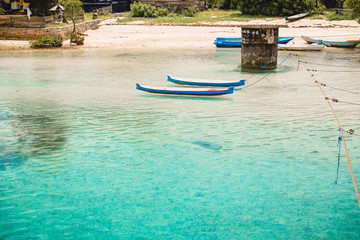 Tropical blue ocean and boats in Indonesia