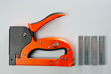 Stapler household, new, orange, reliable with staples
