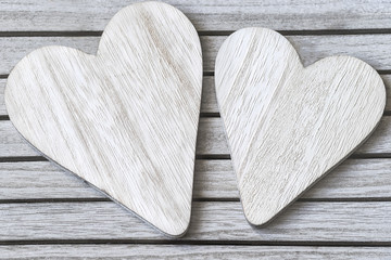 Wooden hearts on a textural rustic background