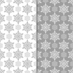 Snowflakes patterns. Set of gray seamless backgrounds with christmas elements