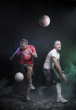 Studio portrait of sportsmen using balls