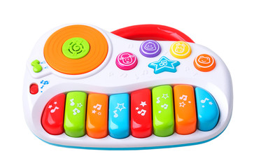 Plastic piano toy object isolated.