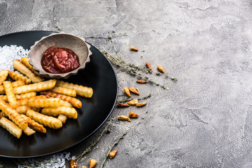 Deep fried french potatoes on dark background
