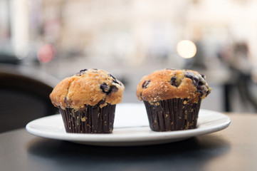 Cupcakes with blueberry on white plate in paris, france