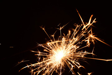 Blank background with bengal fire .Sparkler . New year party sparkler on black background