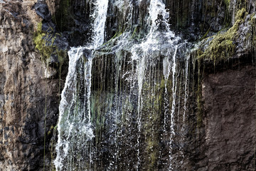 Fototapeta na wymiar Detail of a small waterfall