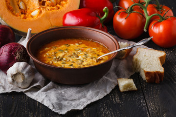 Seasonal hot pumpkin soup, vegaterian food concept