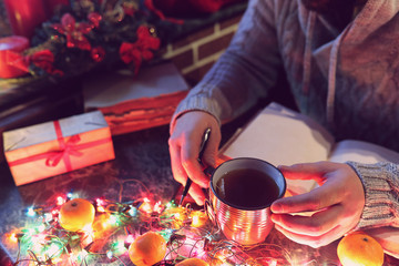man with a blank book in his hands for the New Year's table with