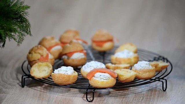 Salmon and creamcheese puffs. Profiteroles or canape