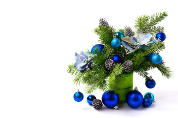 Christmas arrangement silk poinsettias, blue baubles, copy space