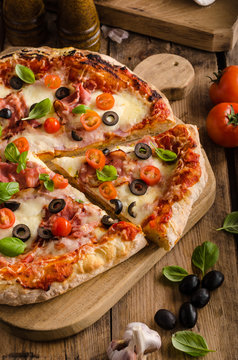 Rustic pizza with tomato, cheese, salami