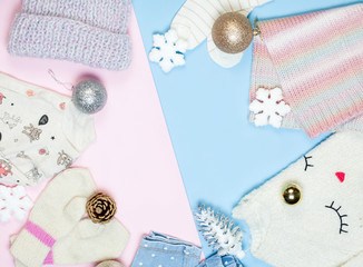 Child's fashion clothes set: sweater, knitted hat, scarf, mittens. Winter christmas decorations. Top view, flat lay