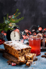 Traditional Christmas cake with fruits and nuts in festive decoration