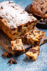 Traditional Christmas cake with fruits and nuts in festive decoration