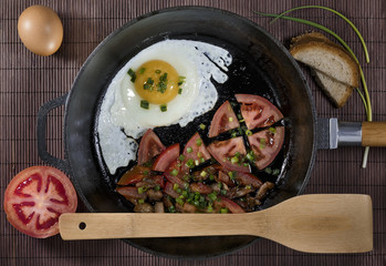 Fried eggs on a frying pan