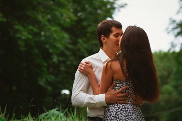 Beautiful young couple on a nature background