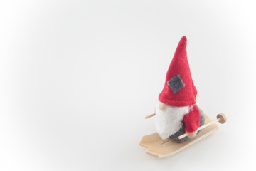 Santa Claus puppet on skis, wood wool