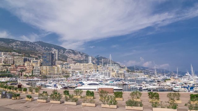 Monte Carlo Port Hercule panorama timelapse hyperlapse. View of luxury yachts and houses around harbor of Monaco, Cote d'Azur.