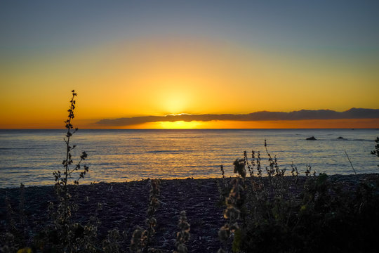 Sunset on Kaikoura beach, New Zealand