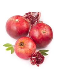 Pomegranate fruit with slice isolated on white background.