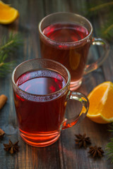 Red tea with orange fruit and spices