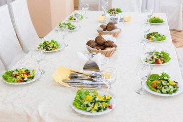 Table served with salad plates for 10 persons with selective focus