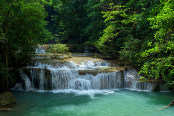 Fototapeta na wymiar Waterfall in forest at Erawan waterfall National Park, Kanchanaburi, Thailand.
