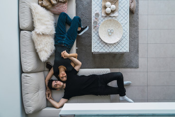 Couple lying on couch