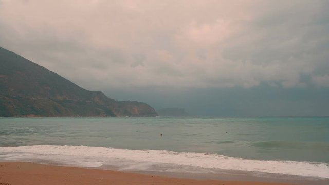 Sea with broken water  and the coastline, Budva, Montenegro, Adriatic, Mediterranean.  Autumn time. Slow motion
