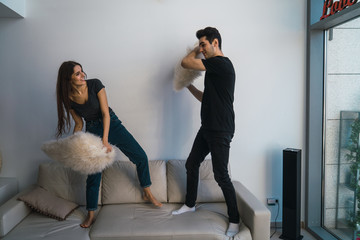 Couple having pillow fight