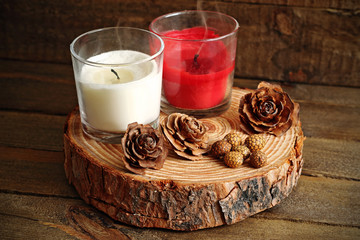 Red and white candles extinguished on wood