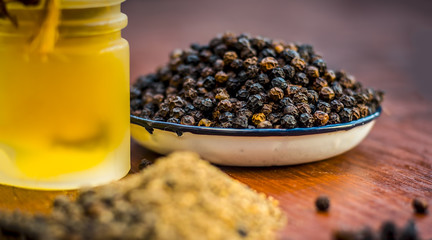Black pepper,Piper nigrum with its powder and oil.