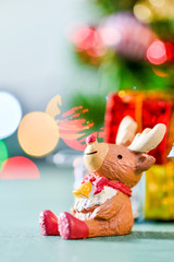 reindeer decoration on colorful light spots background
