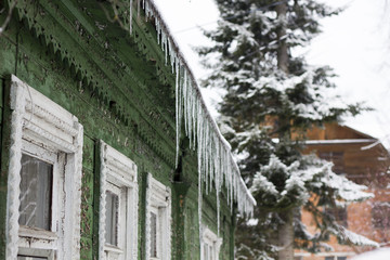 icicles on the roof of the house